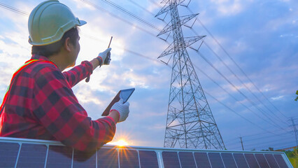 Engineering in standard safety uniform working inspect the electricity high voltage pole with...