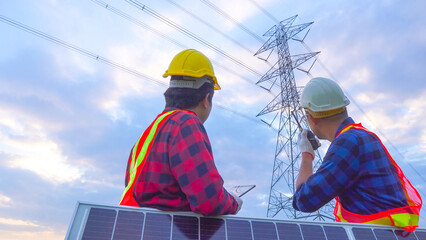 Teamwork engineering in standard safety uniform solar panel inspect the electricity high voltage...