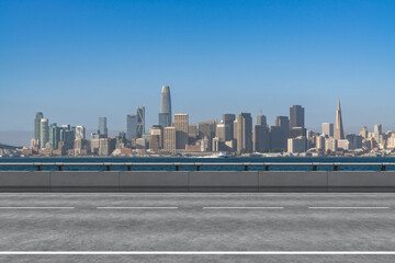 Empty urban asphalt road exterior with city buildings background. New modern highway concrete construction. Concept way to success. Transportation logistic industry fast delivery. San Francisco. USA. - obrazy, fototapety, plakaty