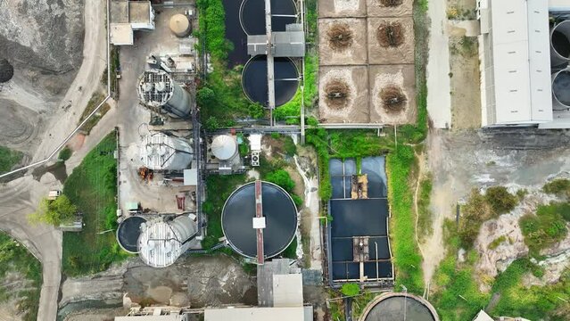 Standing outside the paper and packaging factory, you can hear the rhythmic clatter of machines hard at work, transforming raw materials into essential paper products. Bird's eye view by drone.
