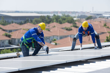 Engineer repair solar panel on the factory rooftop