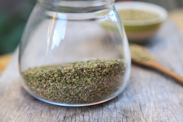 dry oregano on wooden table for healthy eating as a food ingredient for cooking