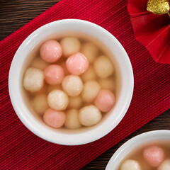 Red and white tangyuan with syrup soup.