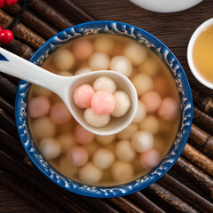 Red and white tangyuan with syrup soup.
