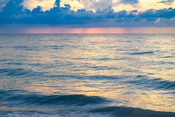 Cloudy sky on sea sunset, sunrise on ocean beach. Sunset landscape in the sky after sunset. Sunrise with clouds of different colors against the sky and sea.