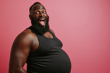 Excited pregnant African American trans man with beard expectant father on pink background. Diversity in parenthood pregnant man challenging gender norms and expanding the definition of family concept