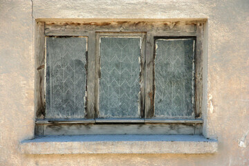 old window of a destroyed house