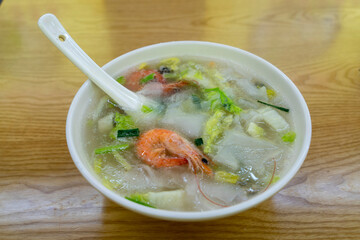 A bowl of delicious seafood noodles with prawns