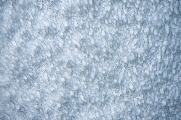 Abstract textured background of snow and ice on window glass