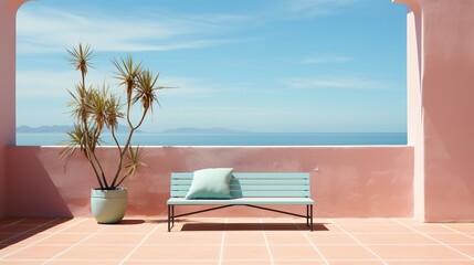 Blue bench on a pink terrace with a potted palm tree overlooking the ocean