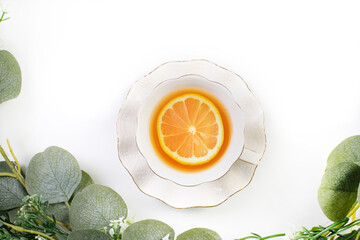 Tea with a lemon slice in a porcelain cup