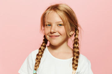 Charming Schoolgirl with Adorable Pigtails: A Cute and Pretty Portrait of a Happy Caucasian Girl in a Summer Studio Setting