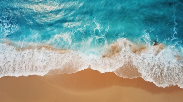 an aerial view of a beach with a wave coming in to the shore and a sandy beach with waves coming in to the shore.