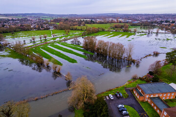 Aerial shot of flooded fields and burst river Avon near to Salisbury cathedral, Wiltshire, UK