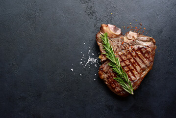 Grilled T-bone beef steak. Top view with copy space.