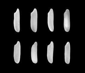 Beautiful raw white organic brown rice grains from top view isolated on black background