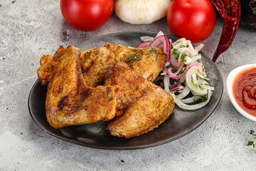 Grilled chicken wings with sauce