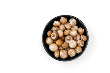 top view of fresh  mushrooms in bowl on white background