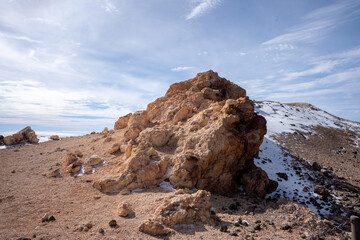 Snow and volcanic rock formations at Mirador del Teide in Teide National Park, Tenerife, Canary...