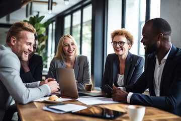 A multiracial group of professionals in a modern office, engaged in a meeting. Teamwork and collaboration concept
