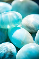 Closeup of a pile of blue Larimar stones