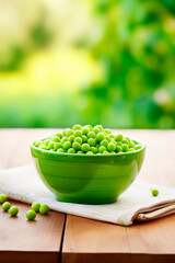 Green peas in a bowl against the backdrop of the garden. Selective focus.