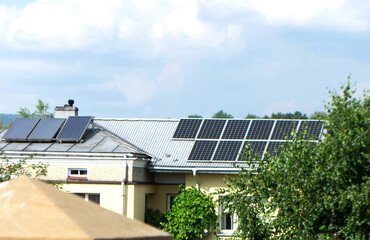 Fototapeta premium Solar power energy on the roof to a standard house