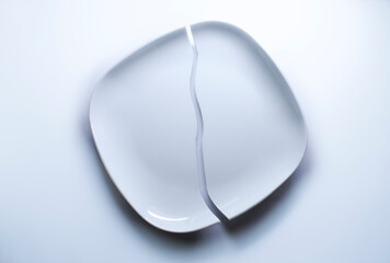 Cracked plate on white background