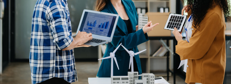 Discussion among businesspeople on the latest developments in solar cell panel technology and Solar Energy Environment city Concept...