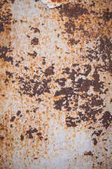 rusty and dirty metal surface with peeling paint.