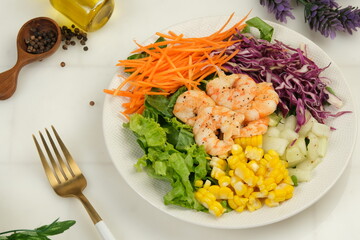 Healthy salad plate,with shrimps and fresh vegetable salad