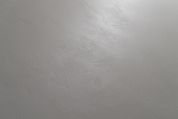 Abstract photo of white wall with light reflection from a light bar