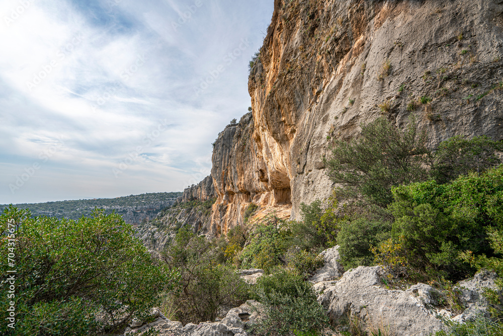 Wall mural Cennet and Cehennem (English: heaven and hell) are the names of two large sinkholes in the Taurus Mountains, in Mersin Province, Turkey. The sinkholes are among the tourist attractions of the province