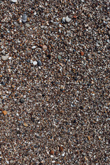 pebble texture. vertical texture of small pebbles. pebbles on the beach