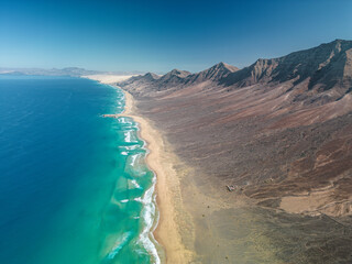 The drone aerial view of Cofete beach in Fuerteventura Island, Canary Islands, Spain.  Playa de...