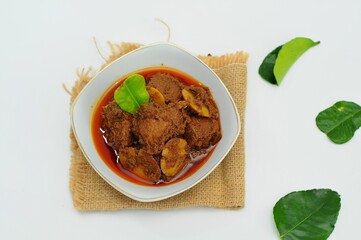 Rendang is an Indonesian West Sumatra Minangkabau spicy meat (commonly beef) that slow cooked in coconut milk and mixed spices, served during festive events like wedding, Eid Al Fitr and Eid