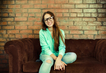 Portrait of a beautiful cute teen girl in the living room