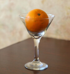 The orange is in a clear glass glass