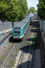 the Paris metro running on the rails