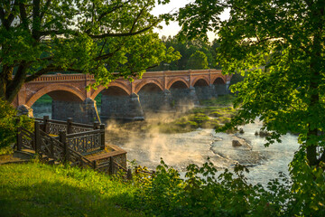 Fototapeta na wymiar old stone bridge Kuldiga in sunset