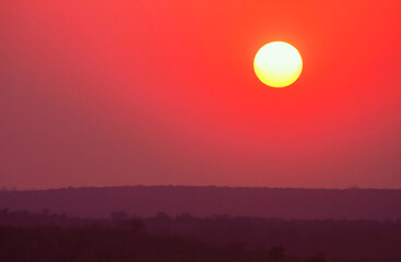 Sunset and evening sky landscape over the African savannah.