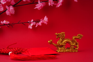 Chinese new year. Year of the dragon decoration on a red background. 
