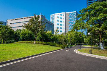 Fototapeta na wymiar Green lawn in front of modern business building