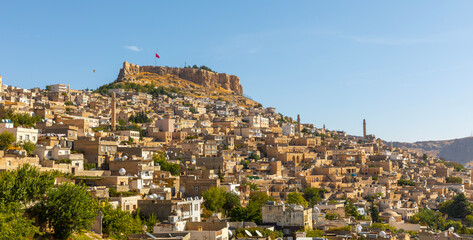 Fototapeta premium Ancient and stone houses of Old Mardin (Eski Mardin) with Mardin Castle, Located South Eastern of Turkey