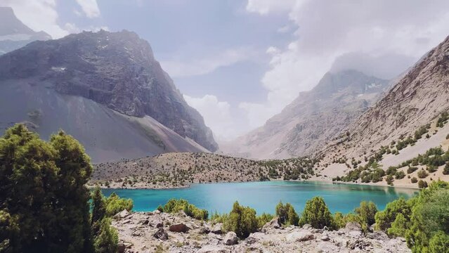 The Alaudin (Chapdara) lakes, lying at an altitude of 2800 m, are considered one of the most beautiful lakes of the Fan Mountains. Turquoise mountain lake. Pamiro-Alai. Tajikistan, Pamir 4K