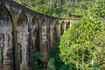 Fototapeta na wymiar A beautiful nine-arch bridge near the city of Ella in Sri Lanka. Top view, aerial photography.
