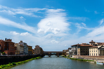 Obraz premium Florence, Italy, July 25, 2023. Ponte Vecchio is a shopping arcade and pedestrian street.