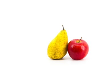 A harmonious blend of colors in this photo: a golden pear and a red apple against a crisp white...