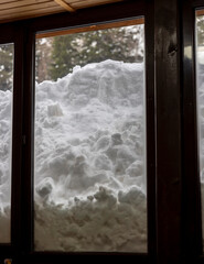 a big pile of snow outside the window
