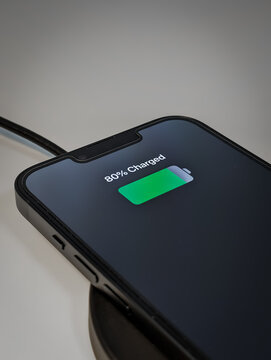 smartphone mobile phone cellphone charging on a wireless charging station using electromagnetic induction